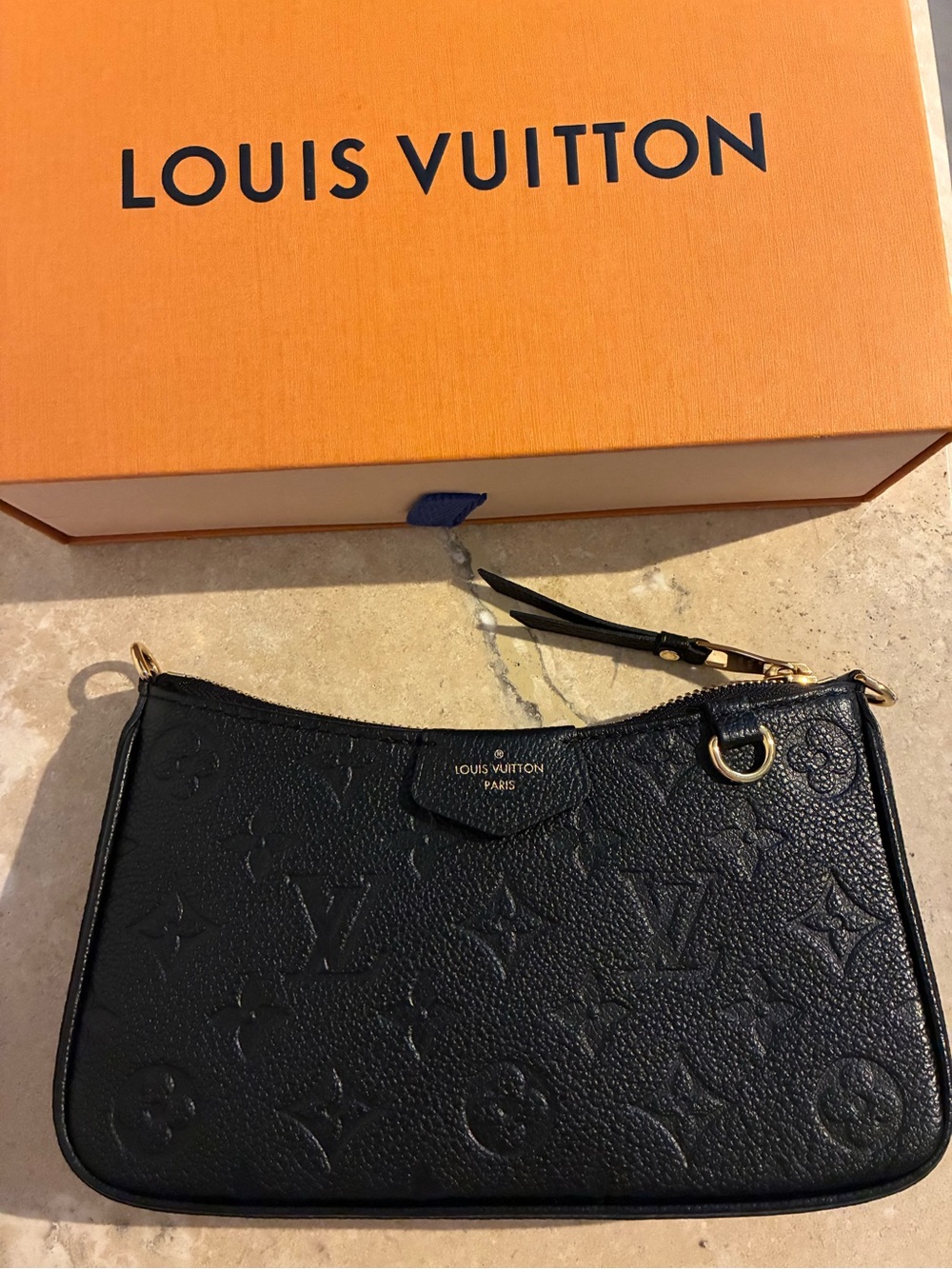 Louis Vuitton Black Monogram Empreinte Pochette - Elegant Leather Wristlet